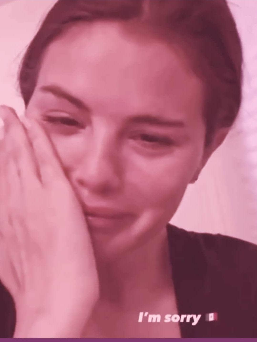 Cute celebrity crying meme featuring Selena Gomez with eye-opening pattern, in a pink-toned setting.
