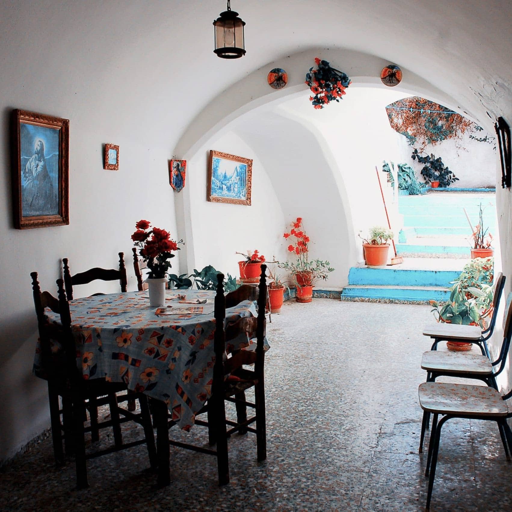 Cozy Greek interior with traditional furniture and vibrant decor, embodying radical humanness.