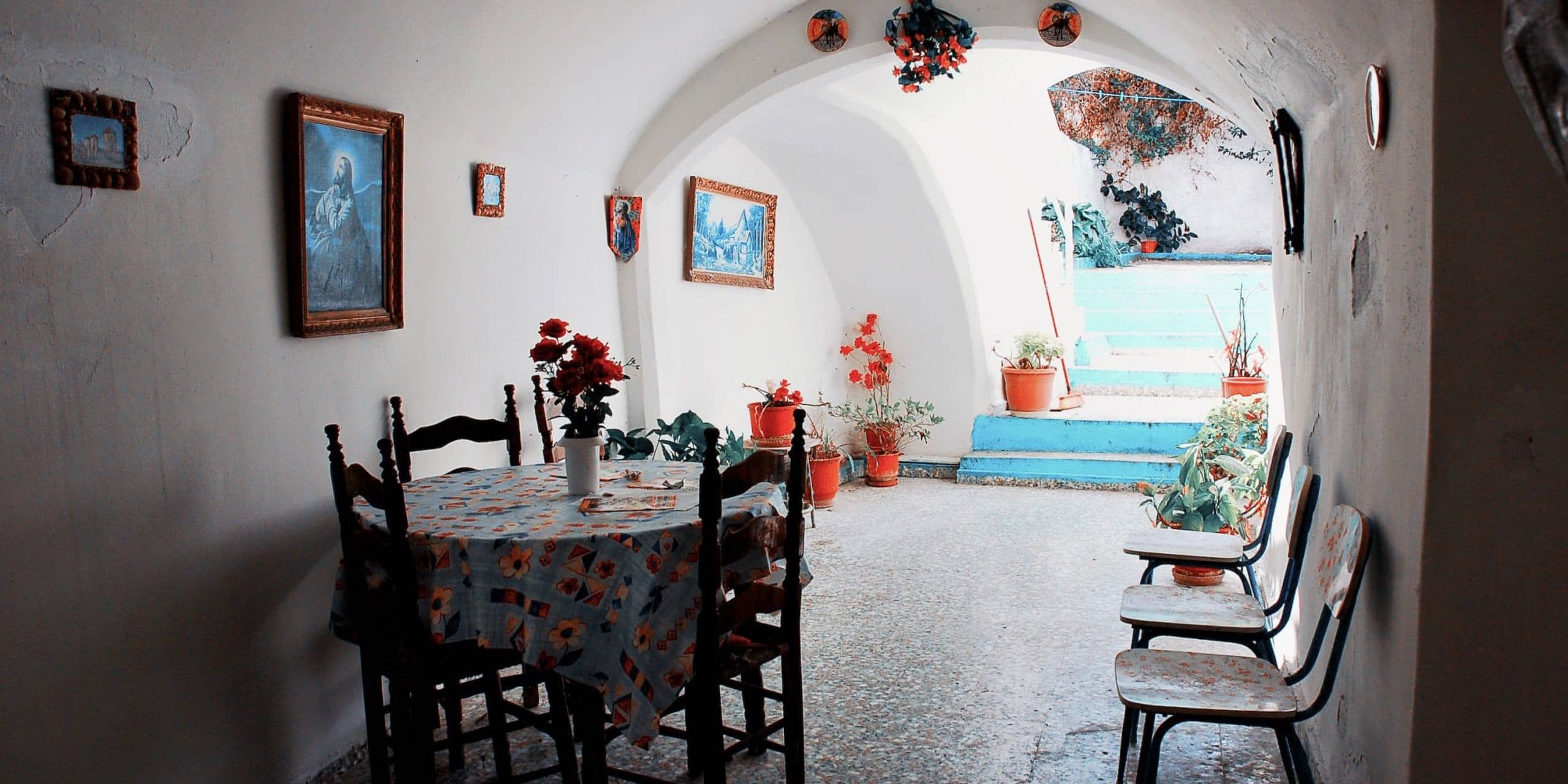 Cozy Greek interior with traditional furniture and vibrant decor, embodying radical humanness.