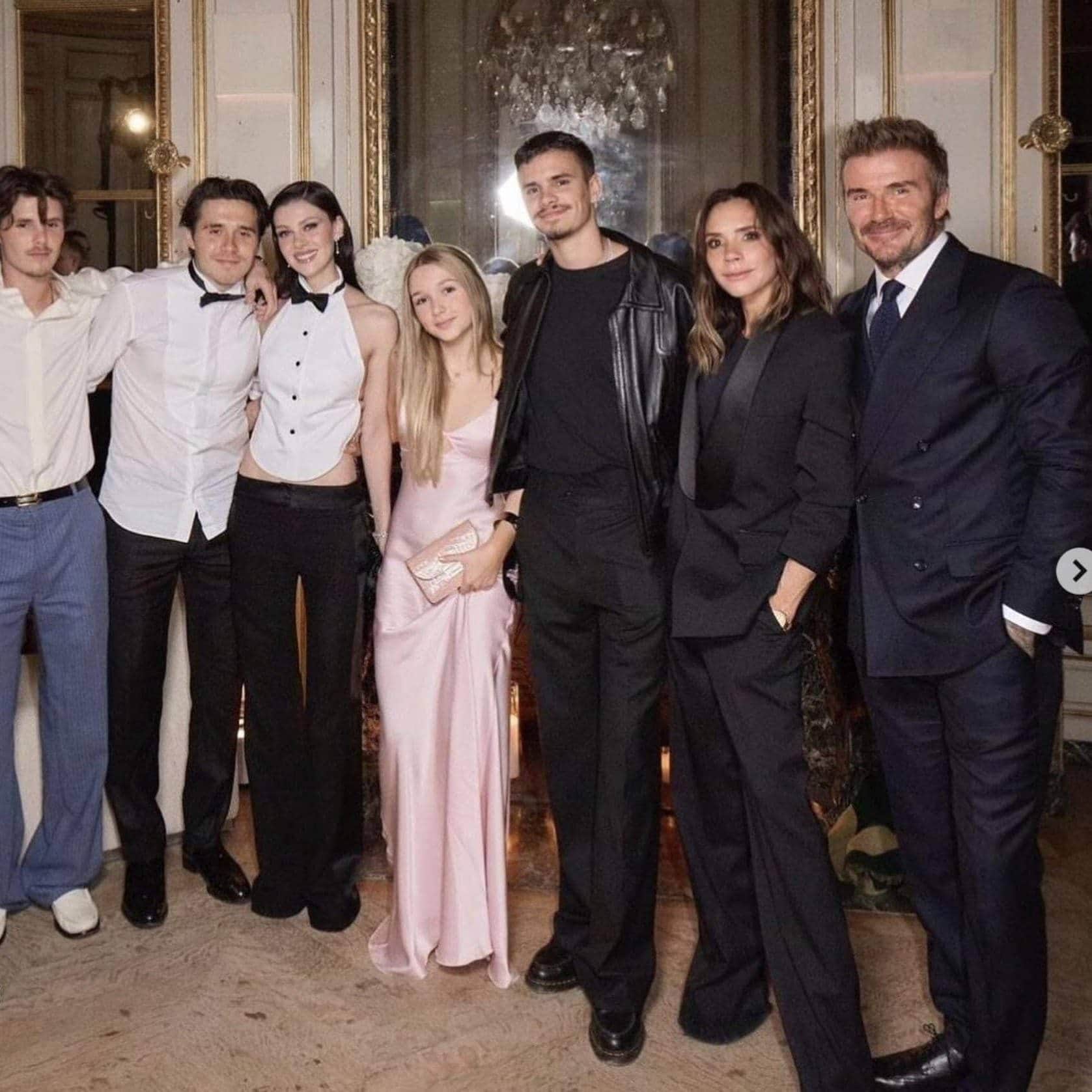 Inside the Beckham family celebrating together at a formal event.
