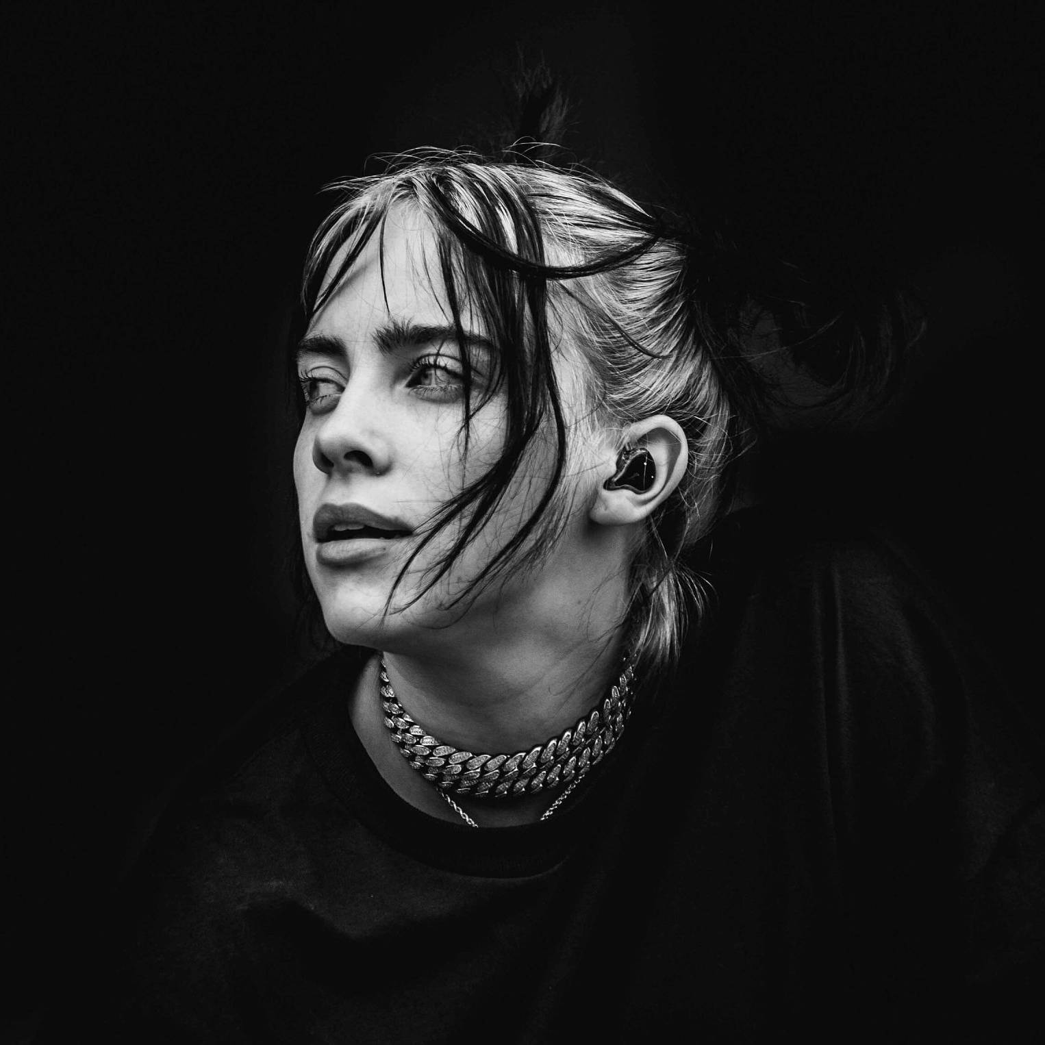 Billie Eilish in a contemplative pose, emphasizing themes of belonging and authenticity related to 