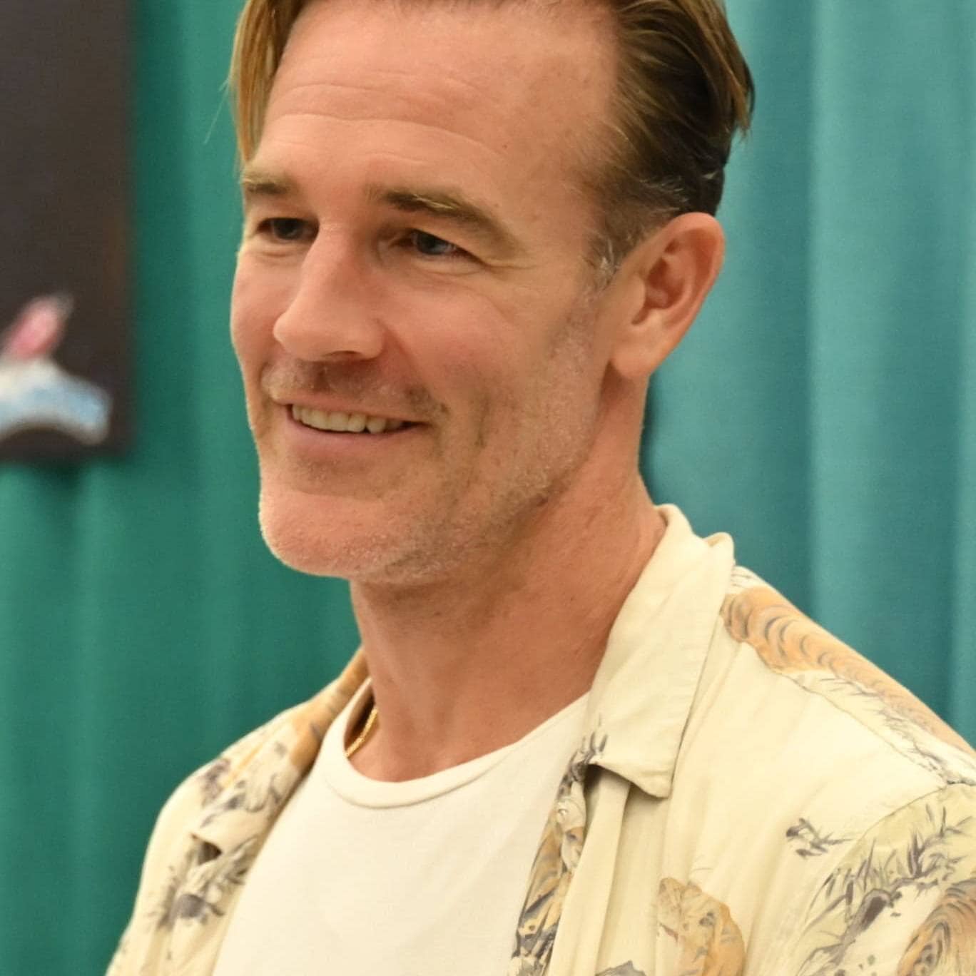 James Van Der Beek smiling at a public event or interview.