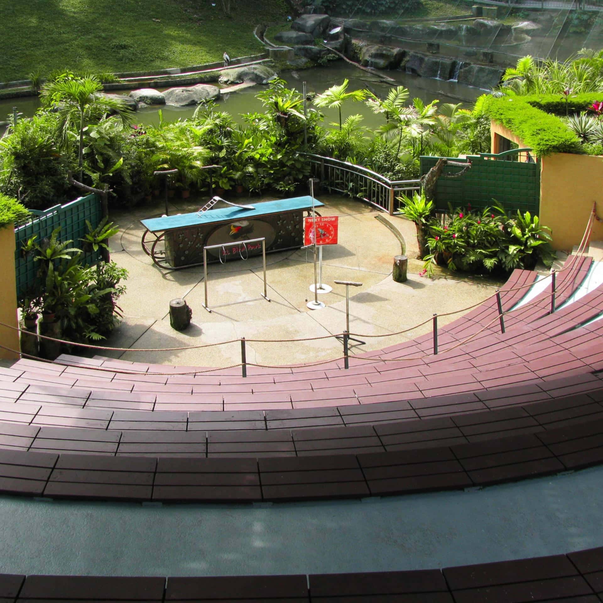 Amphitheater with lush greenery, water features, and seating at Grain of Gold.