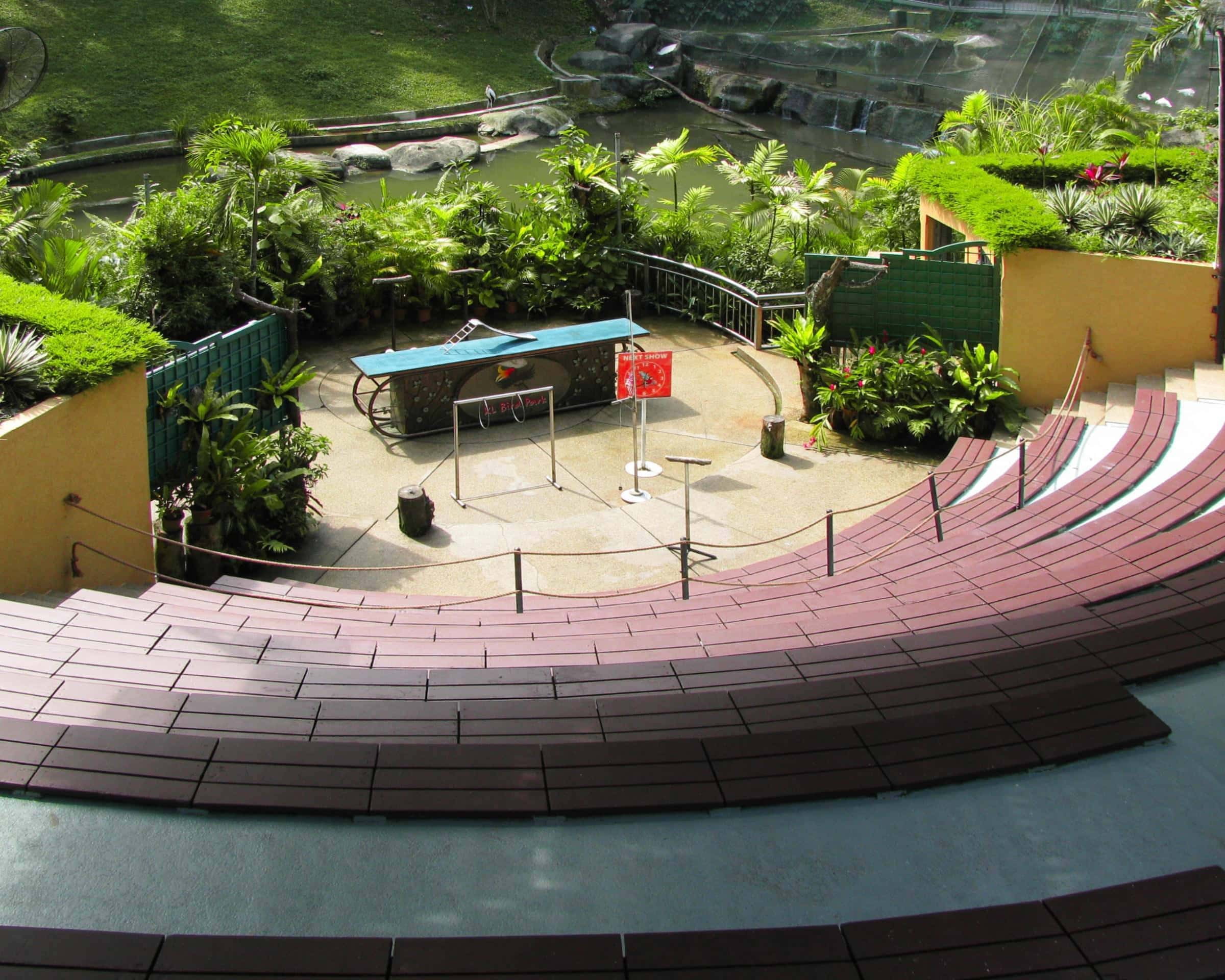 Amphitheater with lush greenery, water features, and seating at Grain of Gold.
