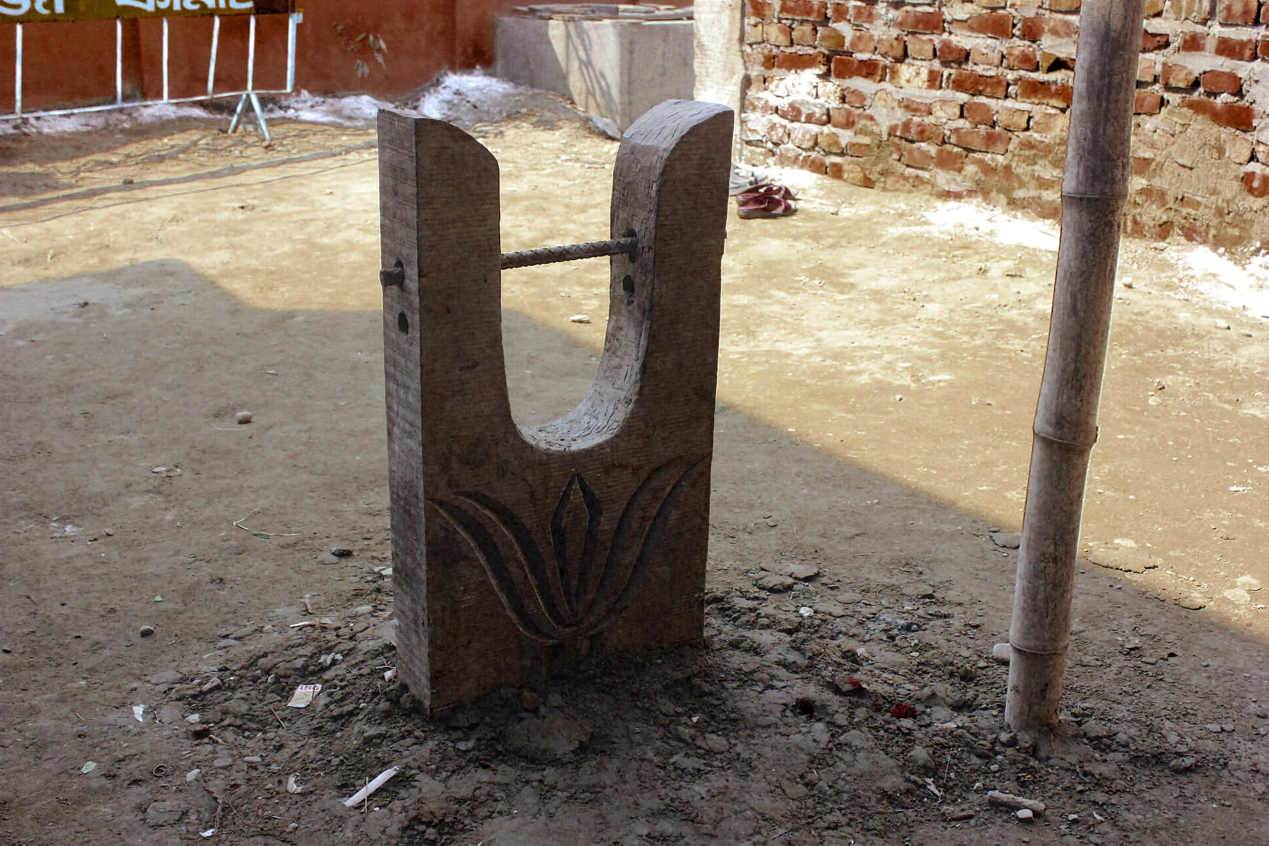Ancient stone sculpture with carved floral design at Grain of Gold archaeological site.