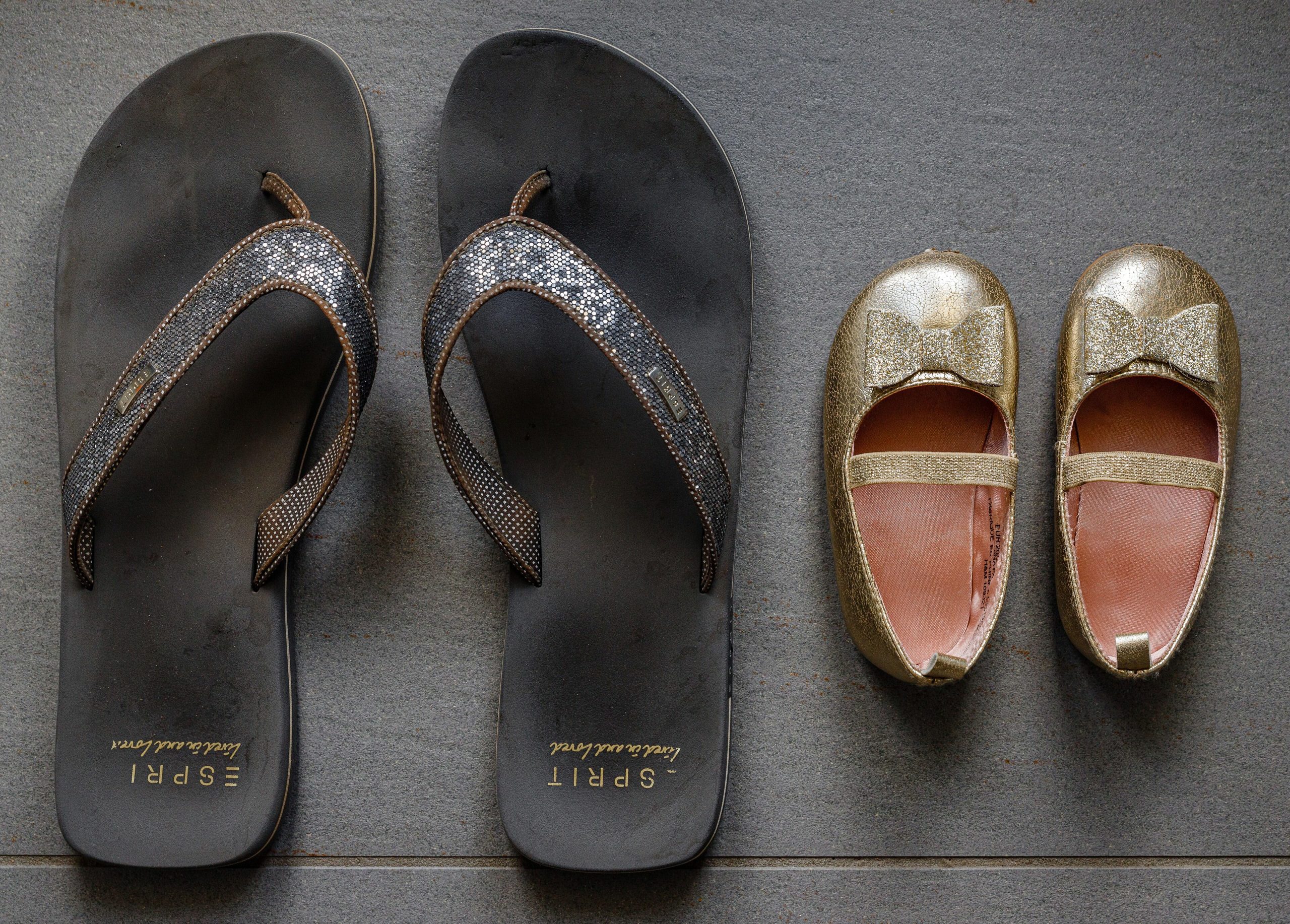 Flip-flops with glittery straps and metallic gold shoes for summer fashion.