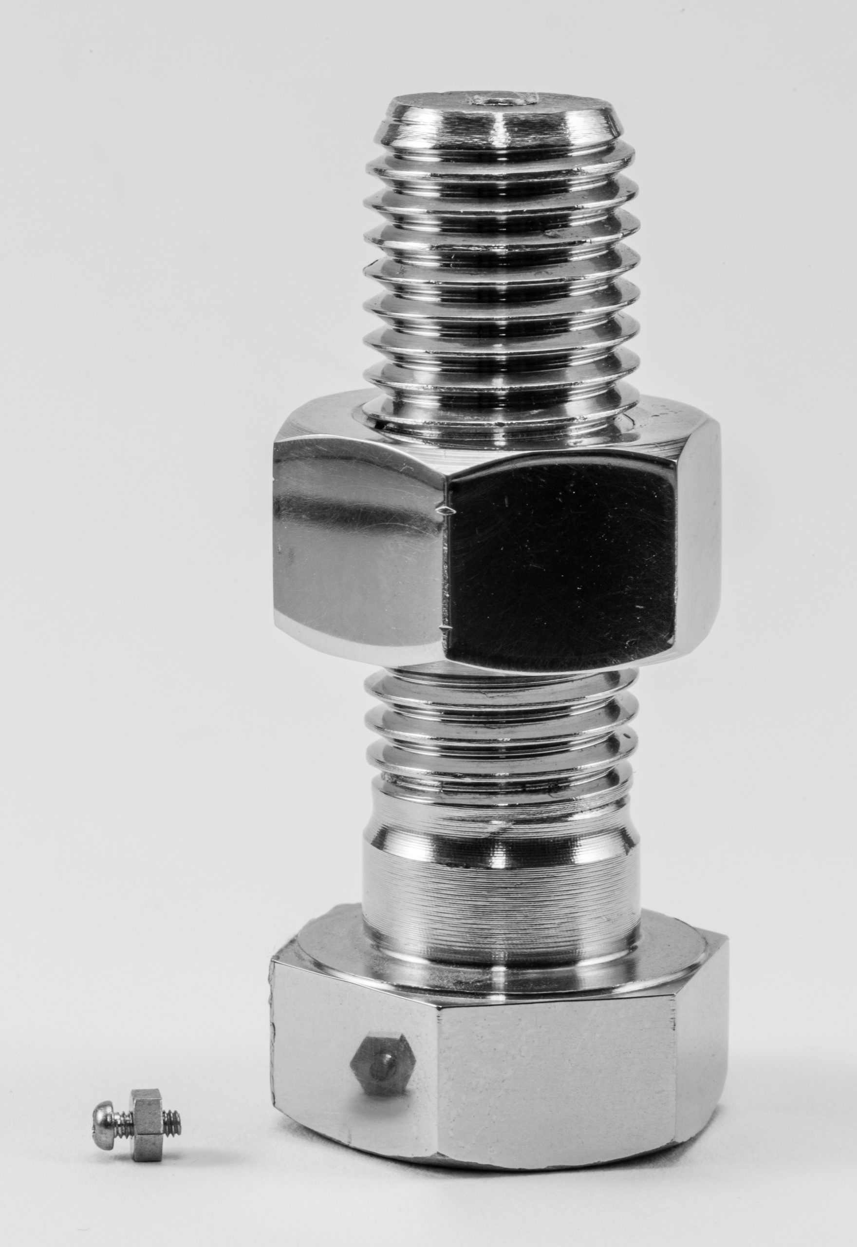 Bolt and nut hardware for industrial applications, emphasizing strength and precision.
