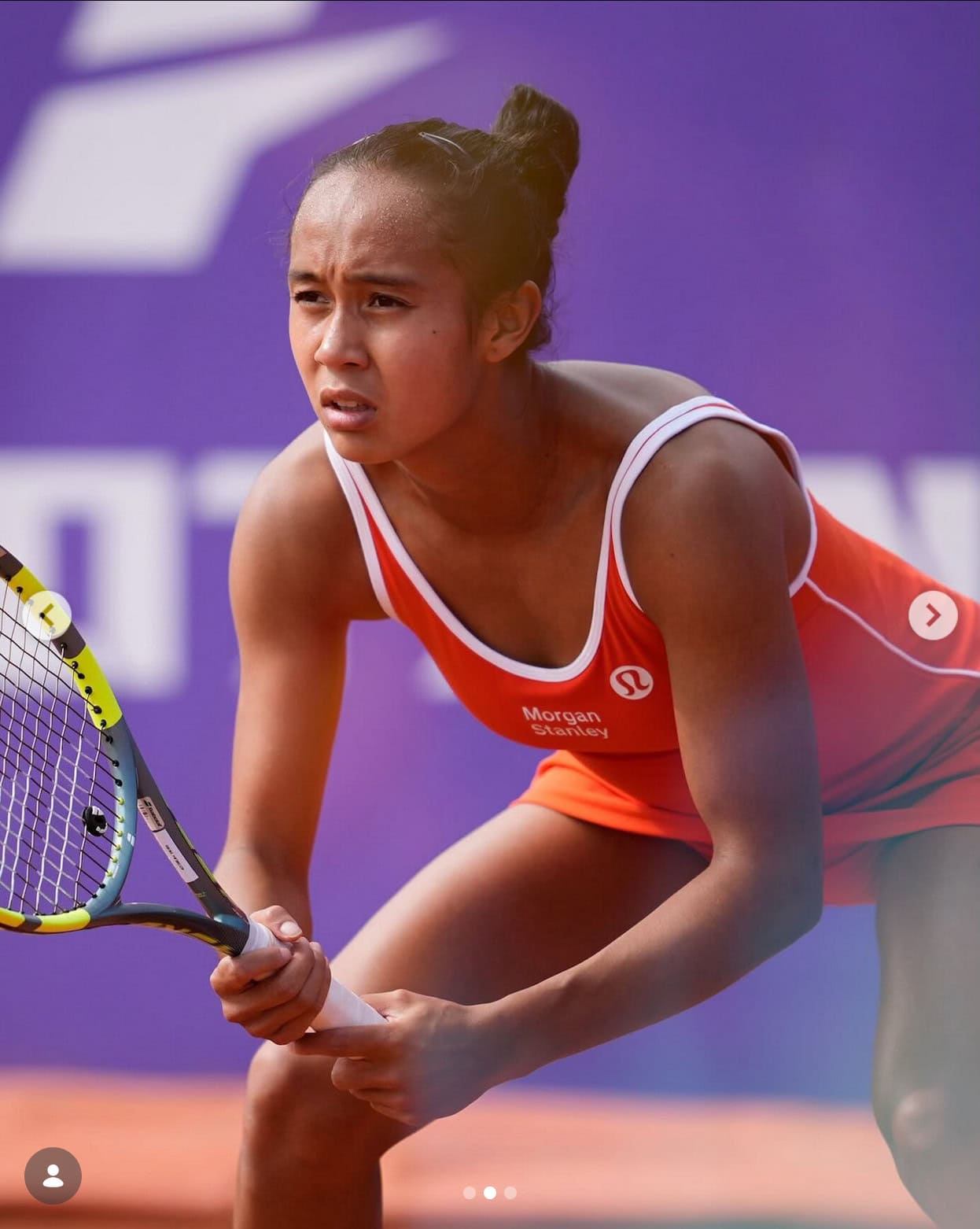Leylah Fernandez during a tennis match, focused and ready to play.