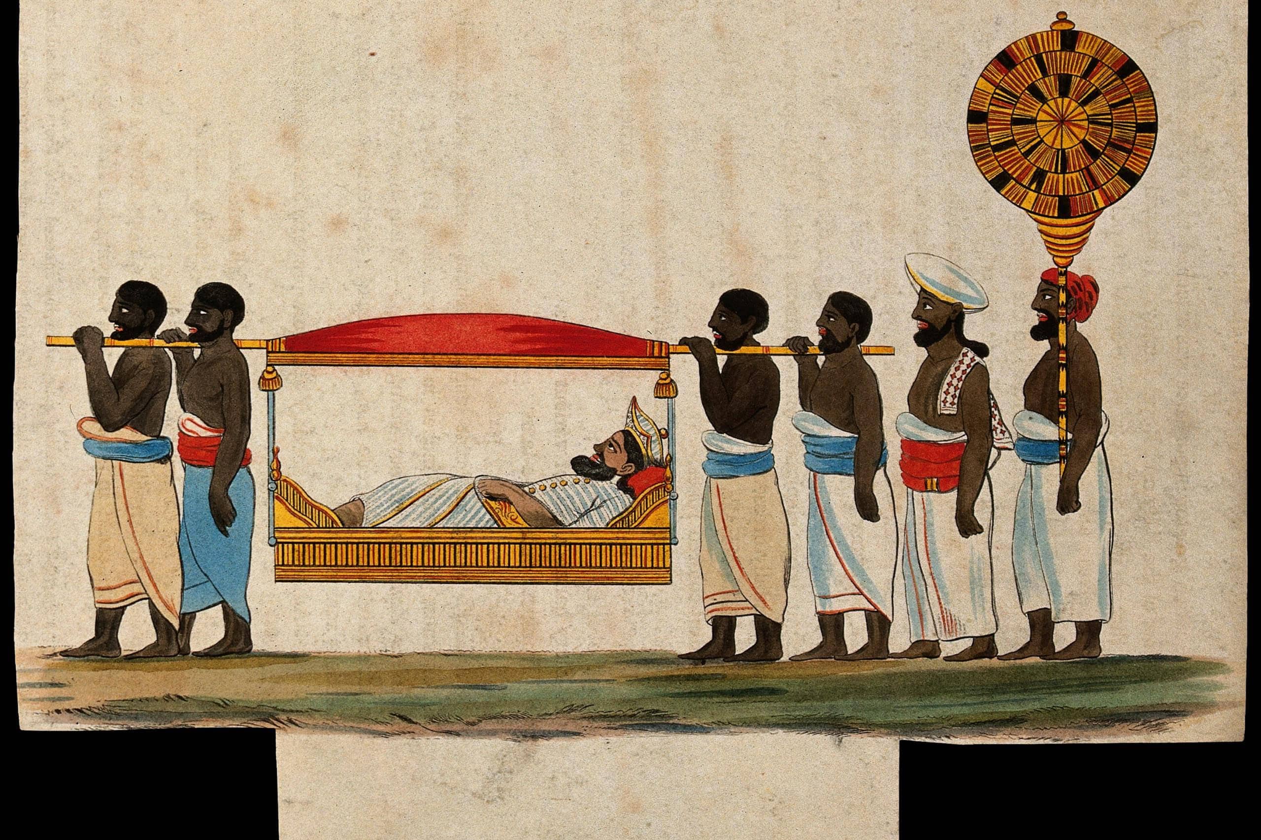 Indian funeral procession with pallbearers carrying a deceased on a decorated bier.