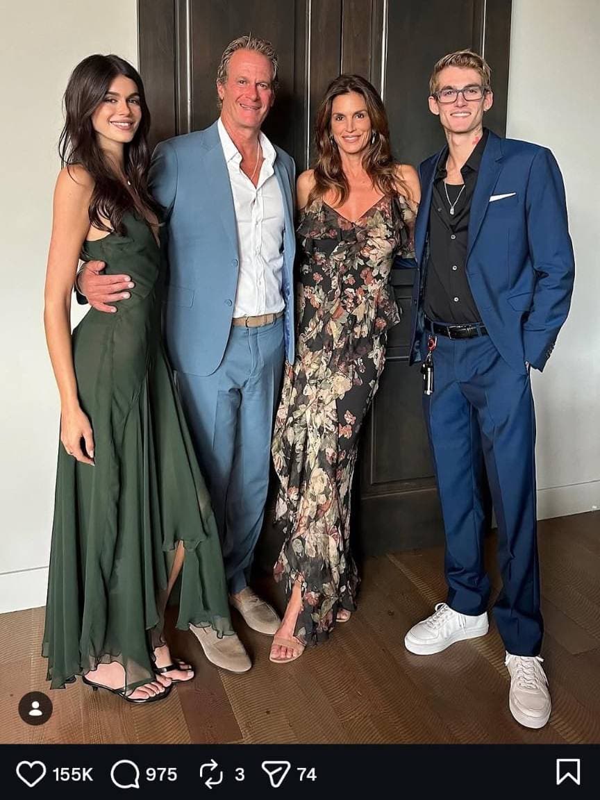 Family dressed elegantly at GRAINOFGOLD event, smiling and posing indoors.